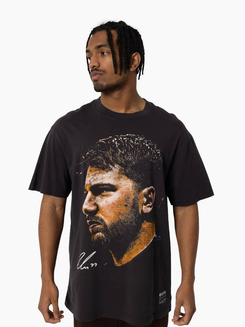 Luka Dončić Big Head Tee in vintage black featuring oversized graphic portrait and signature on front.