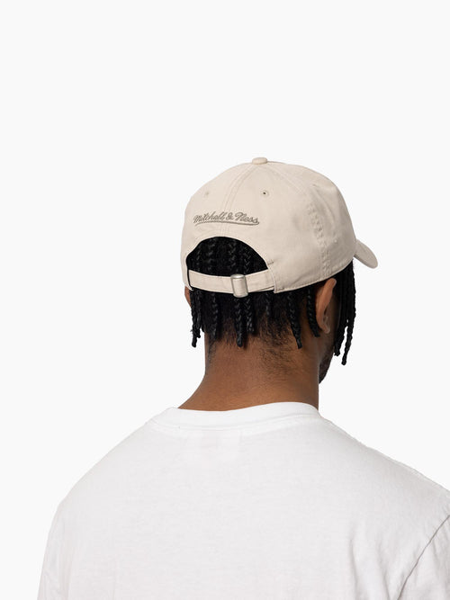 Back view of Chicago Bulls Distressed Tonal dad hat on model. 100% Washed cotton and distressed panelling with strapback closure.