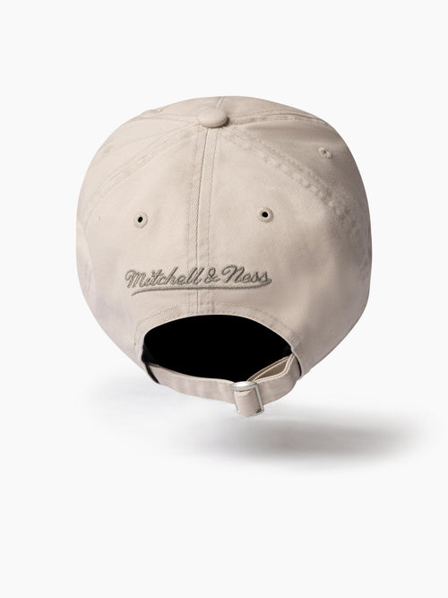 Top view of Chicago Bulls Tonal Distressed dad hat. 100% cotton with distressed panels, embroidered Mitchell & Ness logo and strapback closure.