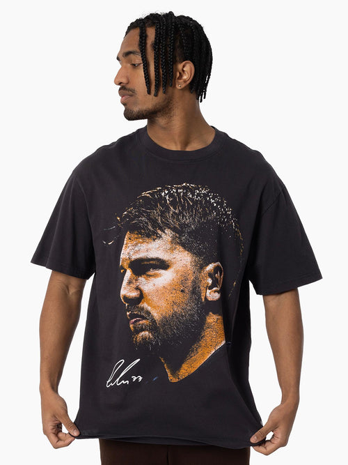 Detail of Luka Dončić Big Head Tee in vintage black featuring oversized player portrait.