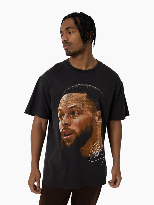 Stephen Curry Big Head Tee in vintage black featuring oversized player portrait and signature on front.